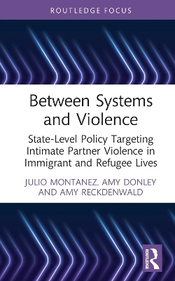 Between Systems and Violence - Julio Montanez, Amy Donley, Amy Reckdenwald